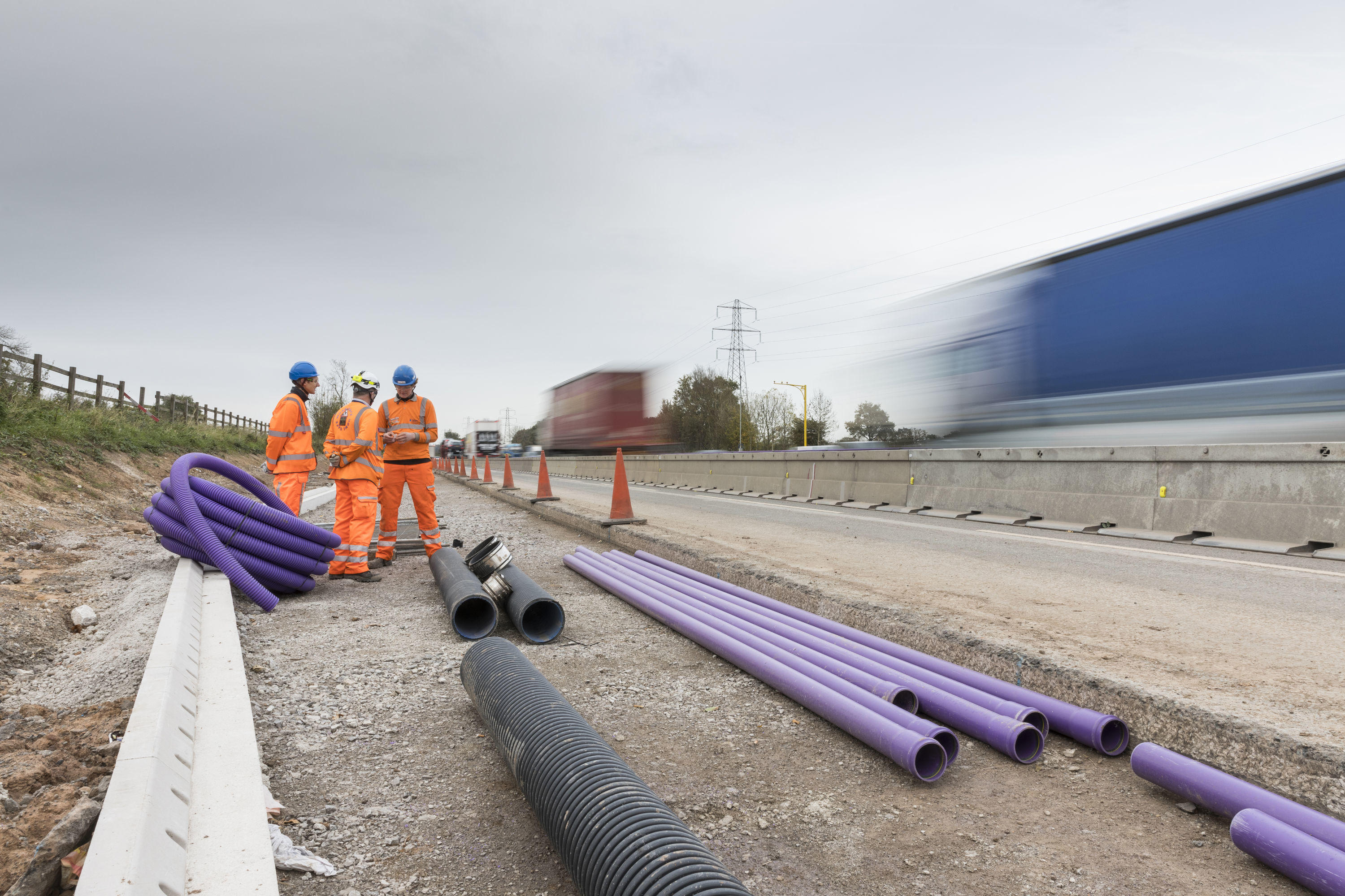 Highway people laying cables